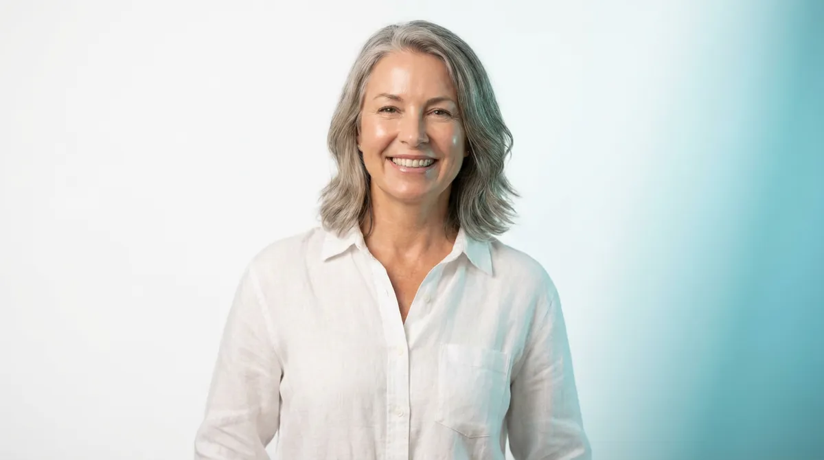 Confident woman with silver hair smiling